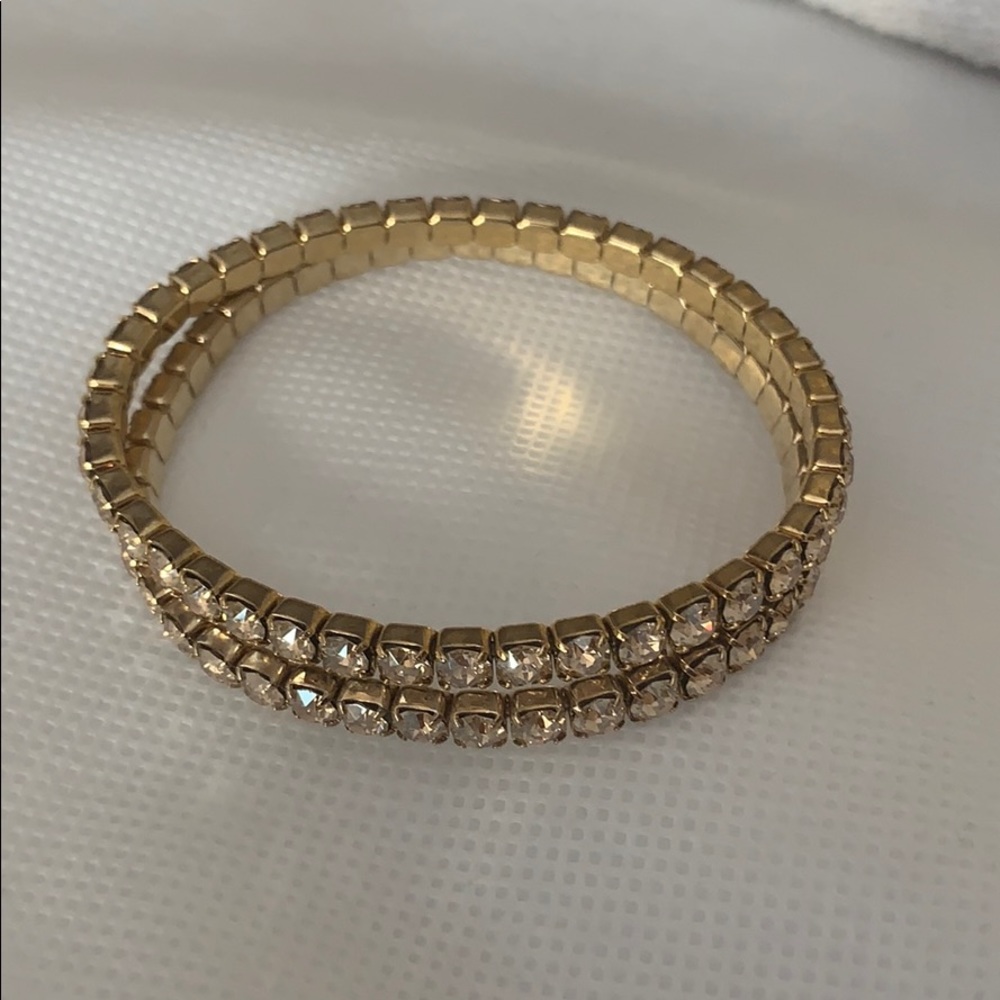 Two gold Swarovski bracelets
